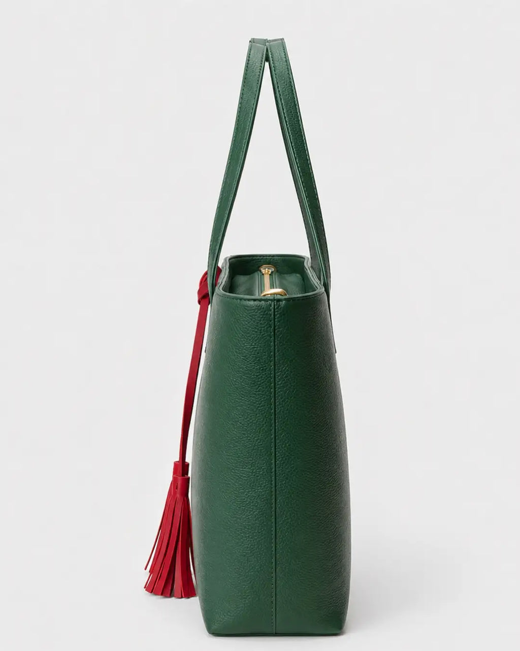 Emerald green leather tote bag with double shoulder straps and red decorative tassels